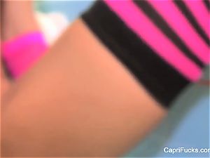 Capri strokes in a peruke and striped socks